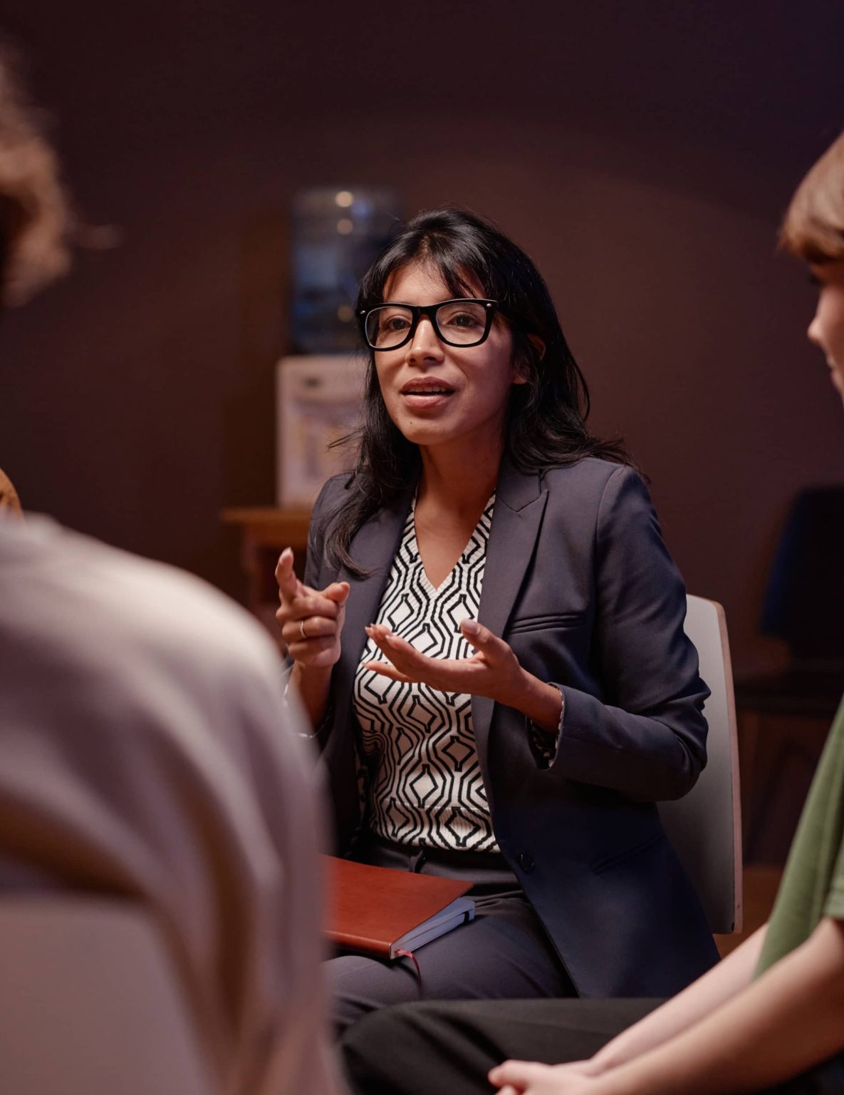 A Wings of Soul adviser talking with a group